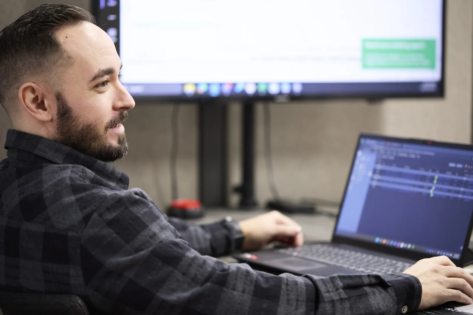 A Black Rock Technologies team member working at a laptop
